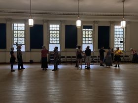 Contra dancers in large hall